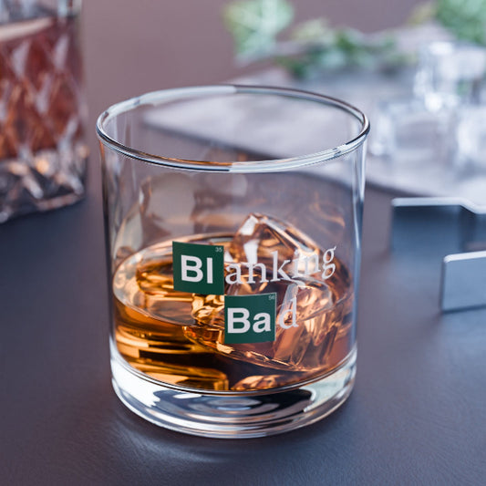 Glass of whiskey with 'Blanking Bad' text on a dark surface