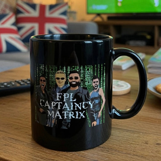 Black mug with 'FPL Captaincy Matrix' design on a wooden table.