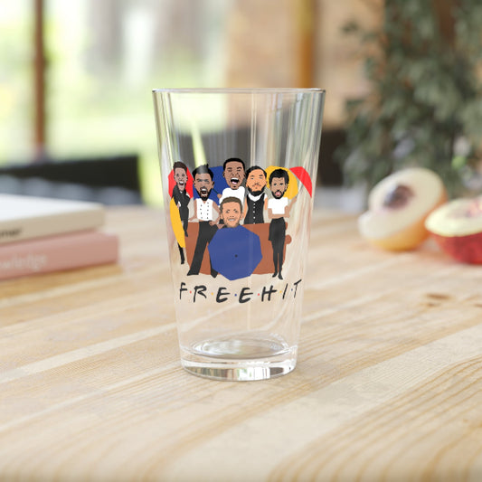 Clear glass with cartoon characters and 'FREEHIT' text on a wooden surface