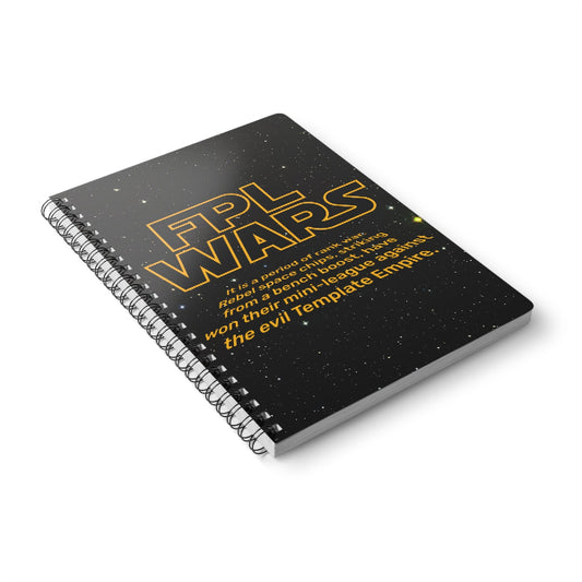 Notebook with 'FPL Wars' text on a black cover with star pattern