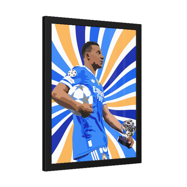 Framed artwork of a soccer player holding trophies against a sunburst background