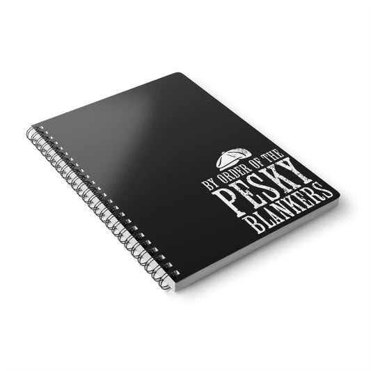Black notebook with white text on a white background