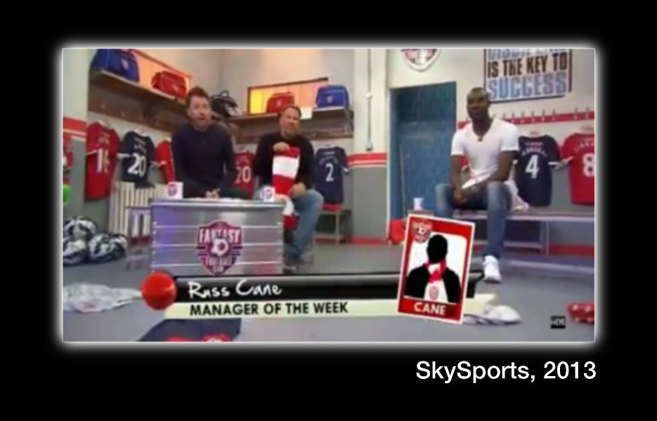 Three men in a sports locker room with promotional graphics for SkySports, 2013.