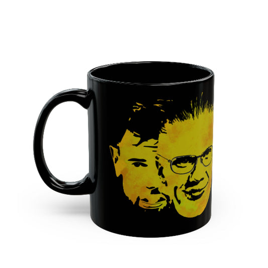 Black mug with yellow graphic of a face on a white background