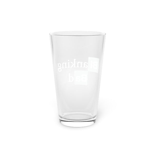 Clear glass tumbler with 'unclaus' text on a white background