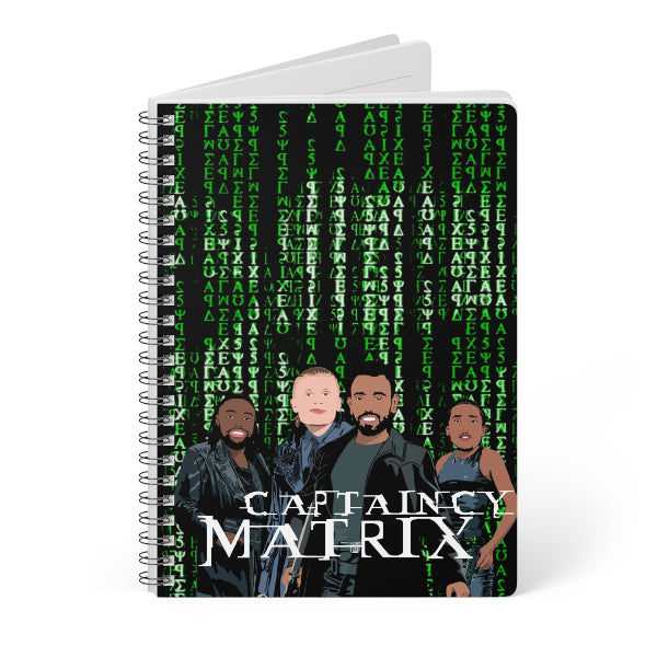 Notebook with 'Captain Matrix' design featuring four characters and green text on a white background