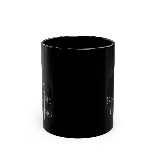 A glossy black ceramic mug with white text partially visible on the sides, shown against a plain white background.