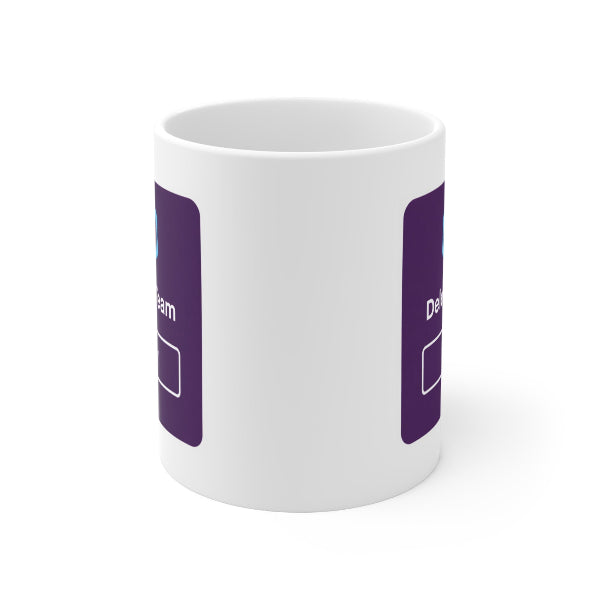 A white ceramic mug with a purple graphic print on the side, shown from a three-quarters angle against a plain white background.