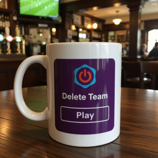 White mug with a purple label featuring a power symbol and text, placed on a wooden table in a bar setting.