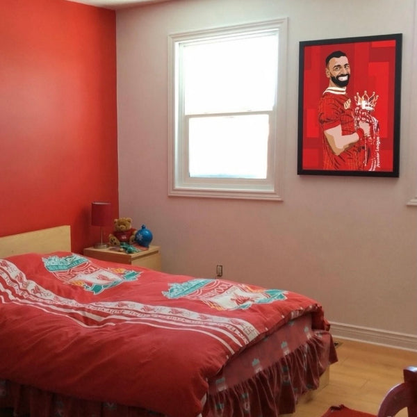 photo of a liverpool bedroom with an illustration of mo salah on the wall