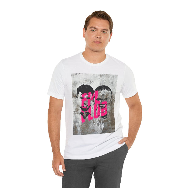 A man wearing a white crewneck t-shirt with a distressed gray graphic print featuring a heart and the word 'LOVE' in pink and black.