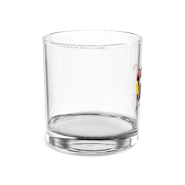 Clear glass tumbler with a colorful design on a white background