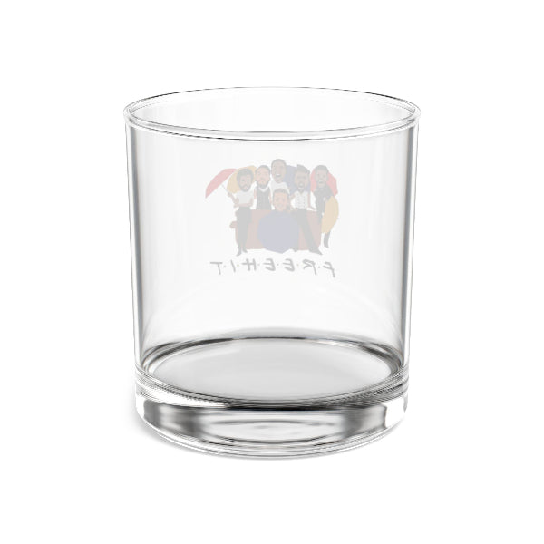 Clear glass tumbler with a colorful logo on a white background