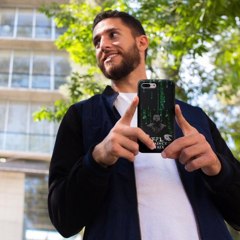 Man holding a phone with a Matrix-themed case outdoors
