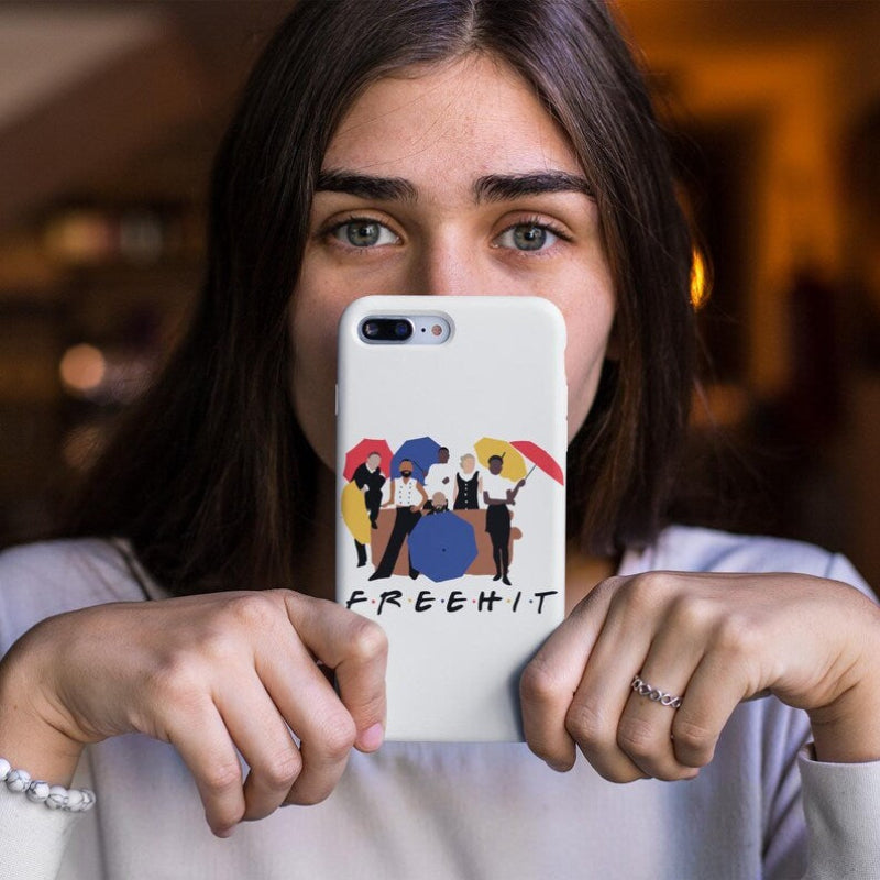 Person holding a phone with a 'FREE HIT' design case