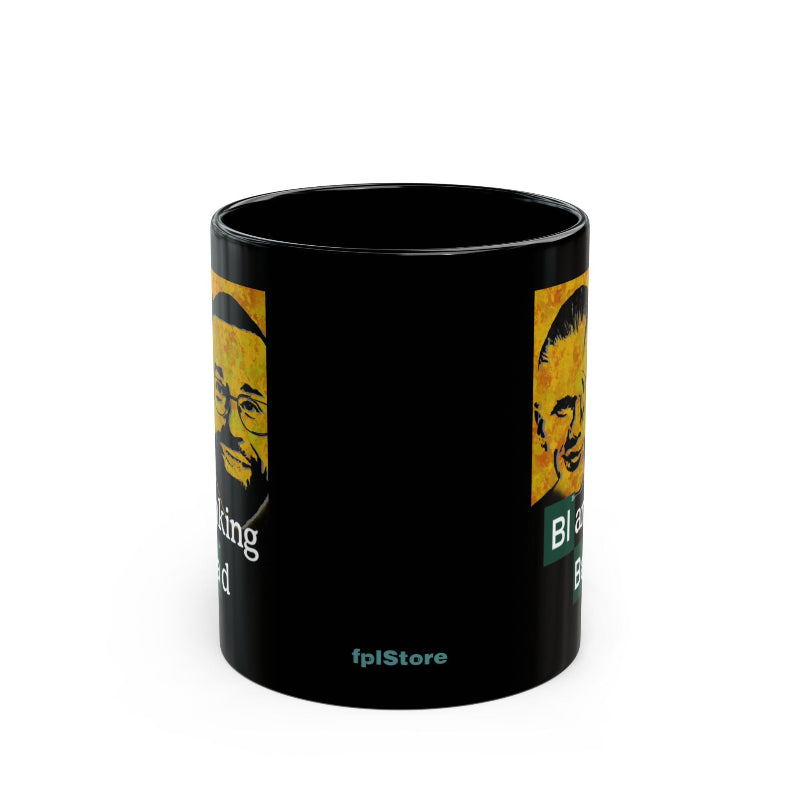 Black mug with yellow and white design featuring a face and text on a white background