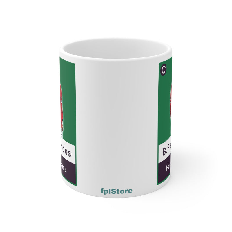White mug with green and purple design on a white background