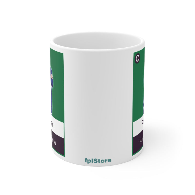 White mug with green and purple design on a white background