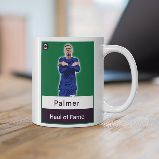Mug with a sports card design featuring a player named Palmer on a wooden surface.