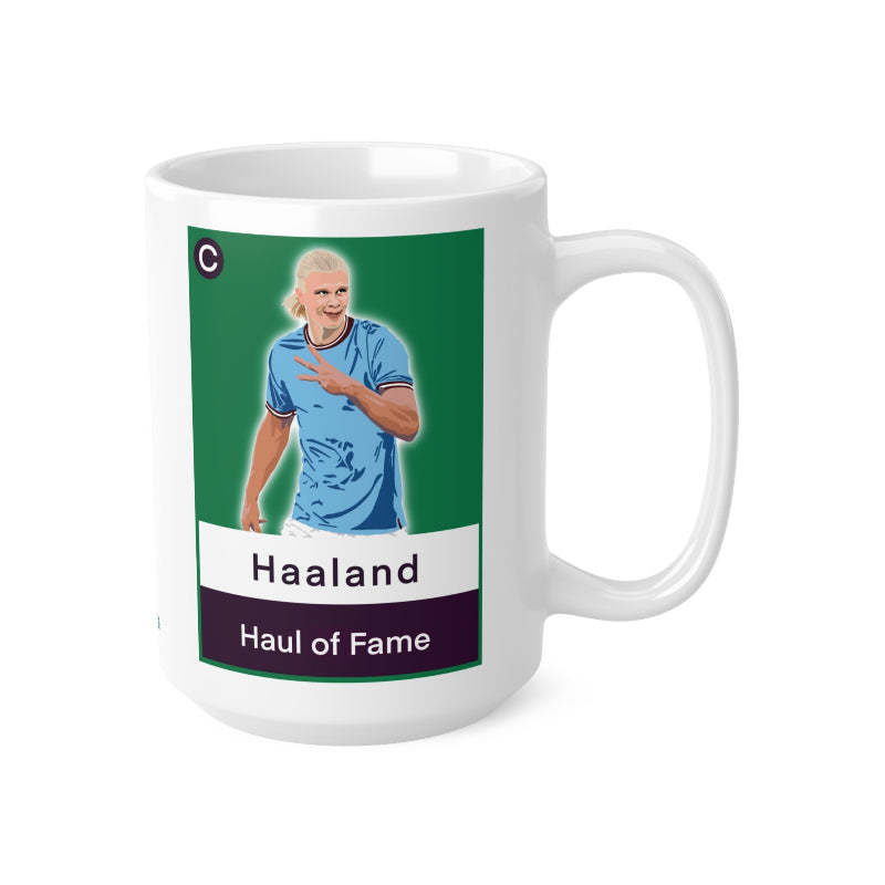 White mug with a graphic of a person in a blue jersey and text on a green background