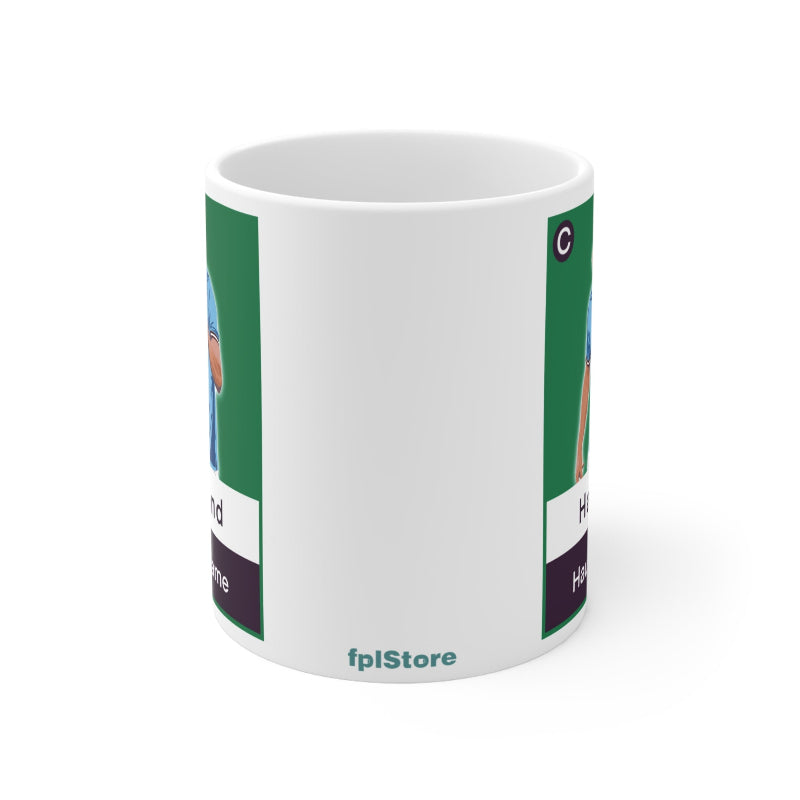 White mug with green and purple design on a white background