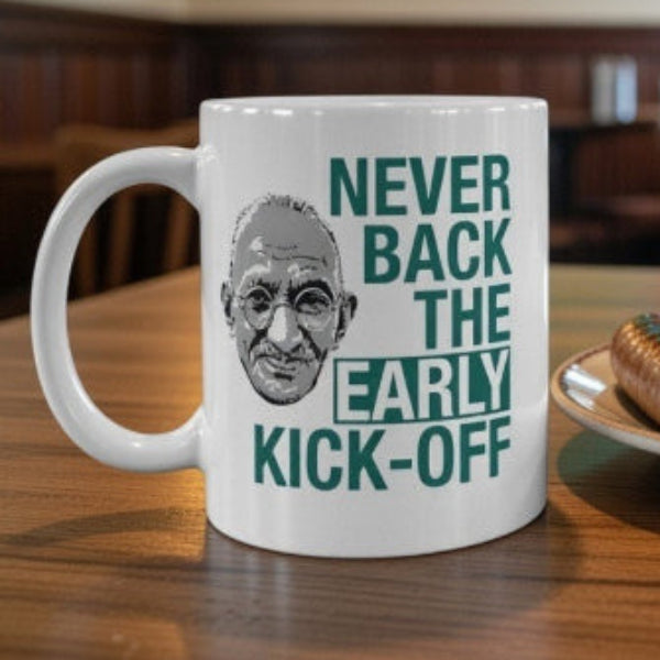 Mug with humorous text on a table with food in a pub setting