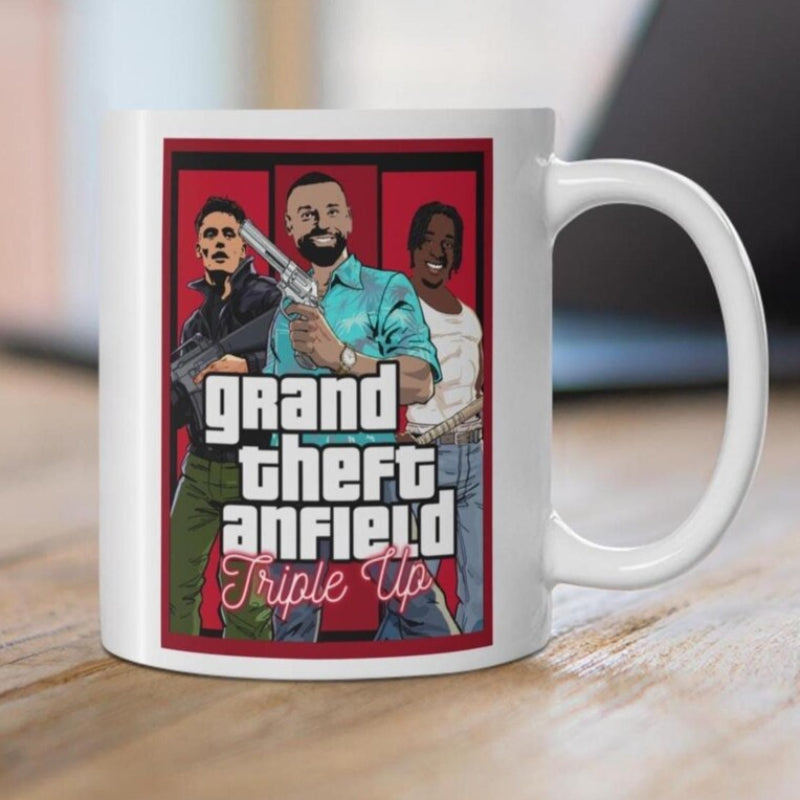 Mug with 'Grand Theft Anfield Triple Up' design featuring three people on a red background.
