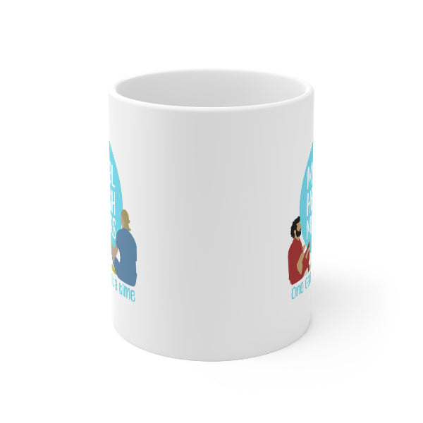 White mug with blue and red graphics on a white background