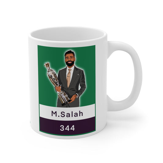 Mug with a graphic of a person in a suit holding a trophy, labeled 'M.Salah 344', on a green and purple background.