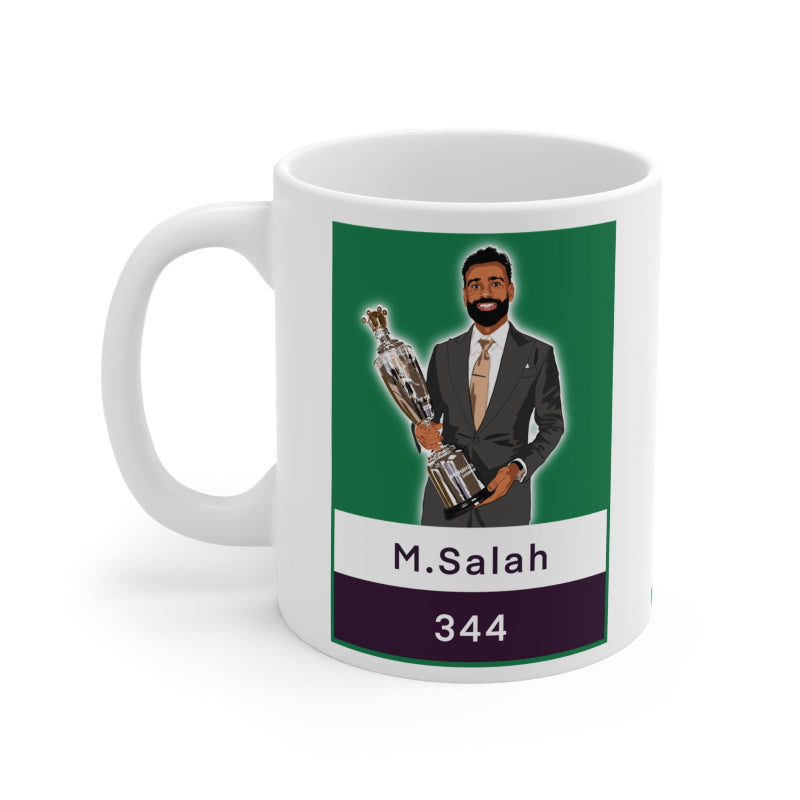 Mug with a graphic of a person in a suit holding a trophy, labeled 'M.Salah 344', on a green and white background.