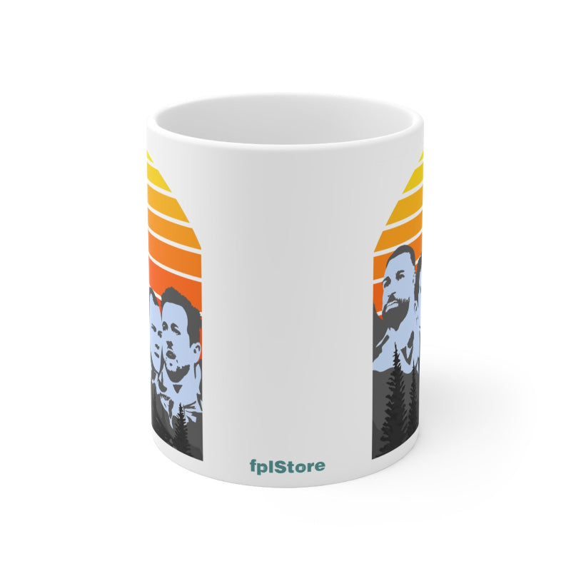 White mug with graphic design of a bearded man and sunset, featuring 'fplStore' branding.