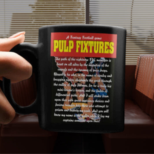 Black mug with 'Pulp Fixtures' text and design held by a hand.