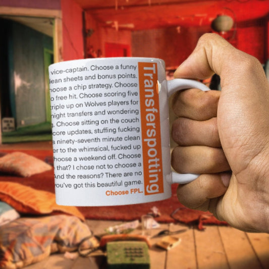 Person holding a mug with text and 'Transferspotting' branding