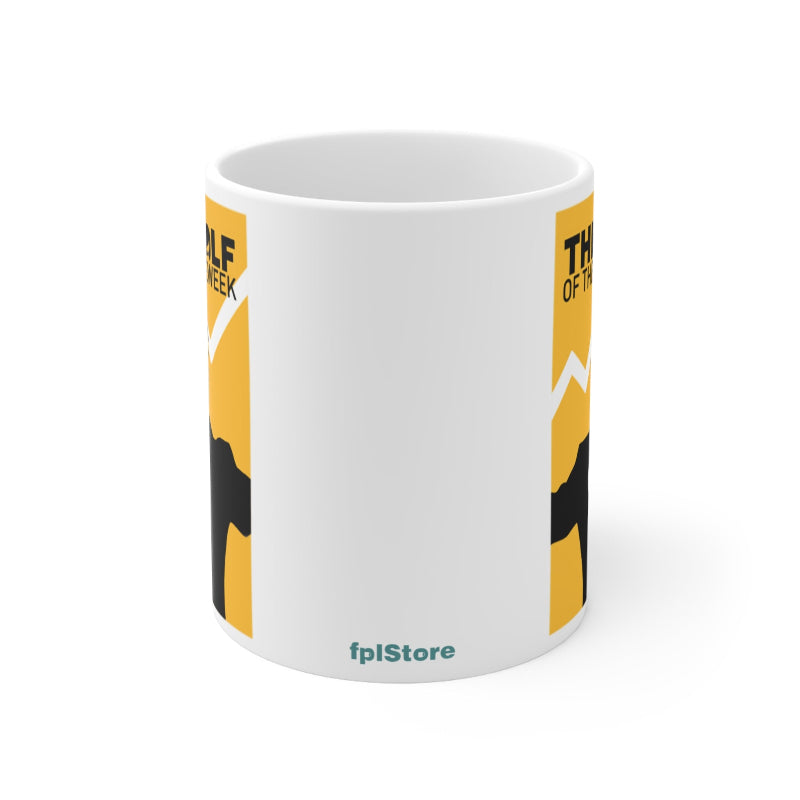 White mug with yellow and black design on a white background
