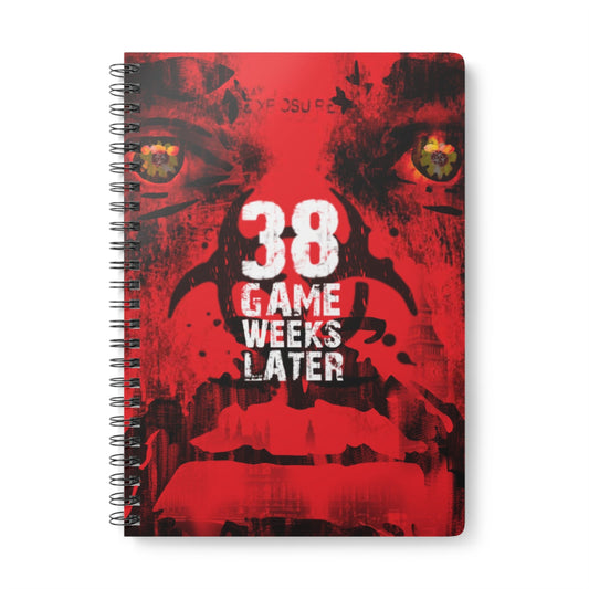 Notebook with a red cover featuring text '38 Game Weeks Later' and a stylized face design.