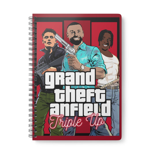 Notebook with illustration of three people and text 'Grand Theft Anfield Triple Up' on a red background