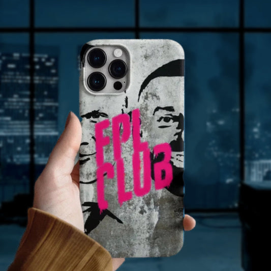 Phone case with a design and 'FPL CLUB' text held by a hand against a blurred cityscape background