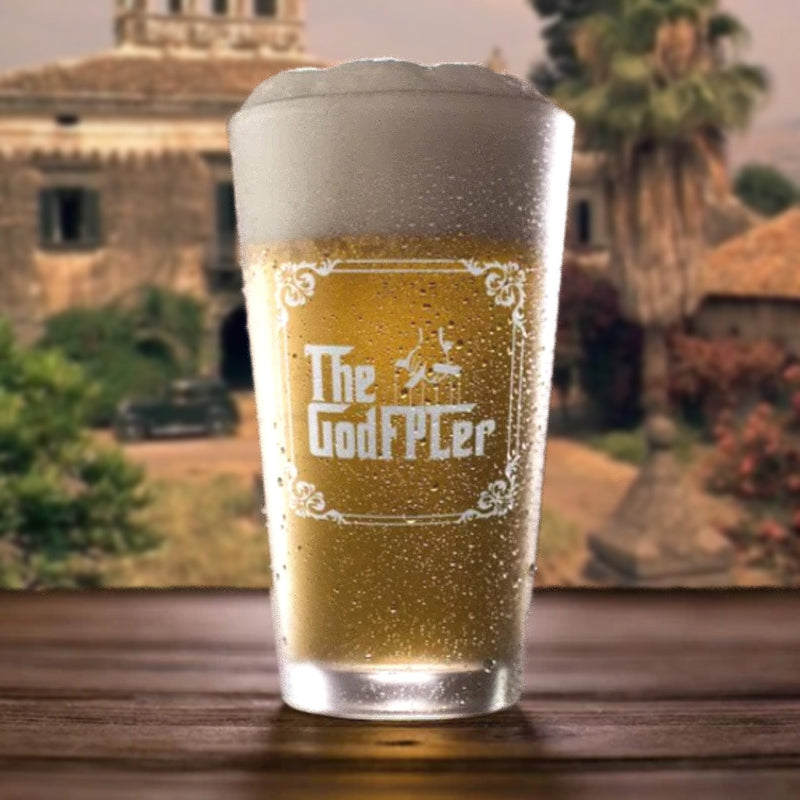 Pint of beer with 'The GodFPLer' branding in a scenic outdoor setting