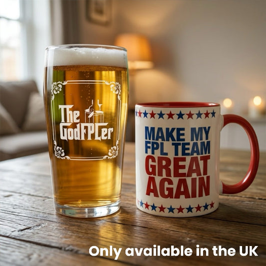 GodFPLer pint glass and Make My FPL Team Great Again mug standing side by side on a wooden table as an FPL mini-league prize bundle