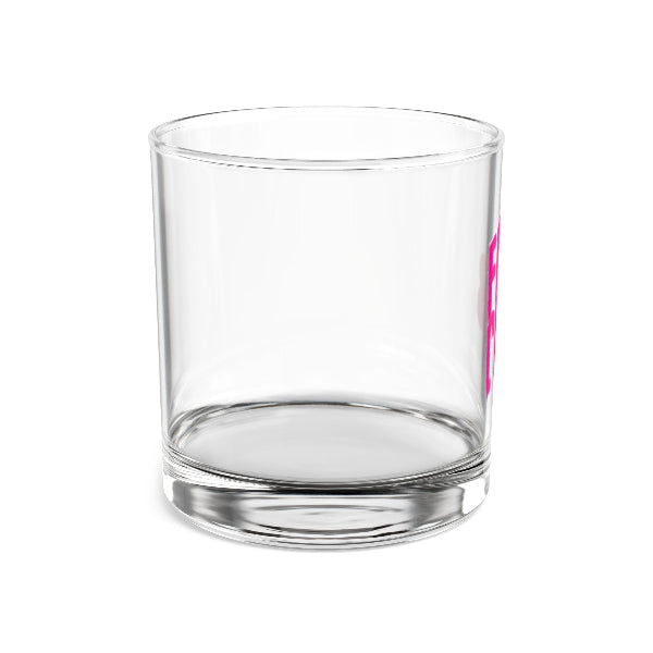 Clear glass tumbler with a pink design on a white background