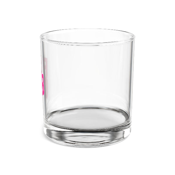 Clear glass tumbler with pink logo on a white background