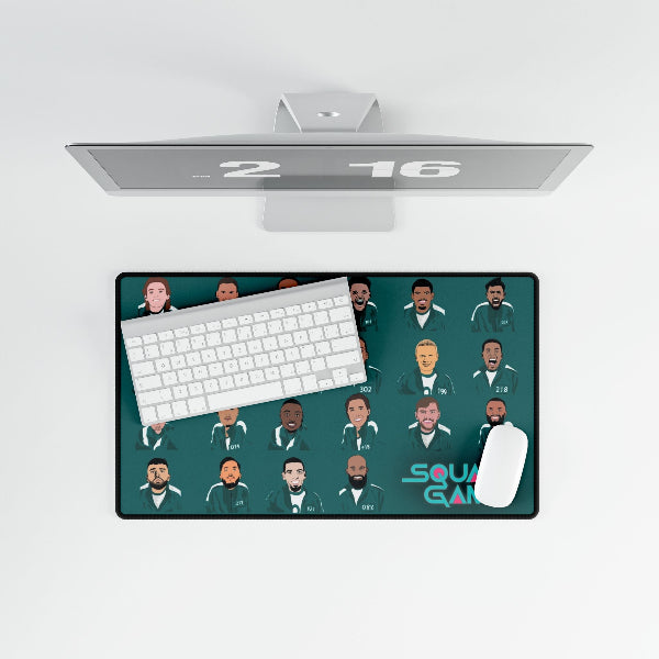 Computer setup with a monitor, keyboard, and mouse on a decorative desk pad.