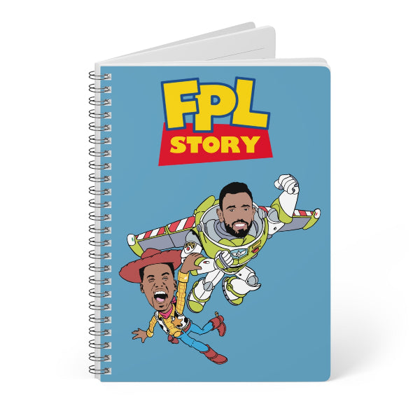 Notebook with cartoon characters and 'FPL Story' text on a blue background
