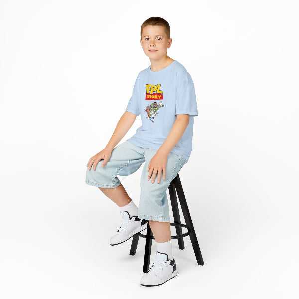 Child sitting on a stool wearing a light blue t-shirt with a graphic design, light blue shorts, and white sneakers on a white background.