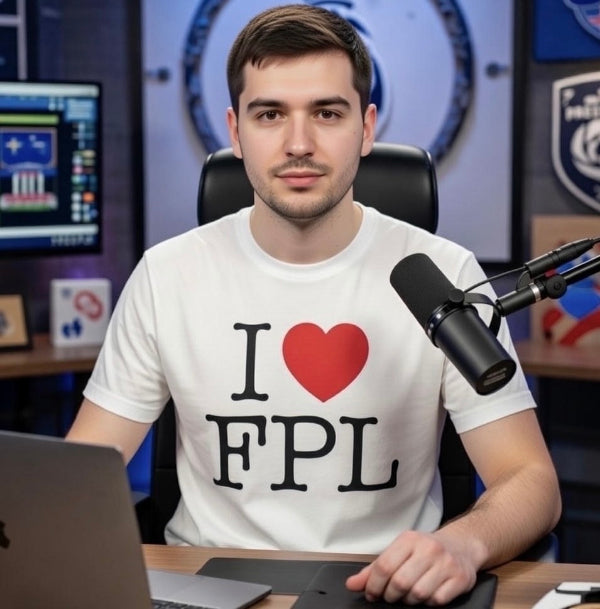 Man wearing a 'I ❤️ FPL' shirt sitting in front of a microphone and computer.
