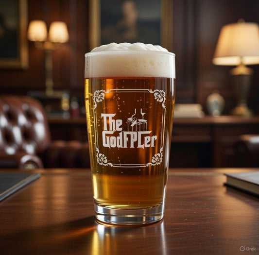 Pint of beer with 'The GodFPLer' branding on a wooden table in a cosy room.