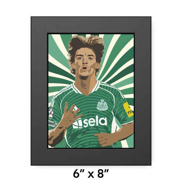 Framed artwork of a soccer player in a green jersey with a brand logo on a white background.