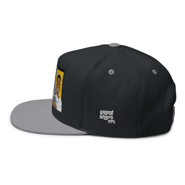 A black snapback cap with a gray flat brim, featuring a custom graphic patch on the front and a white 'grand theft ffl' logo on the side, shown against a plain white background.