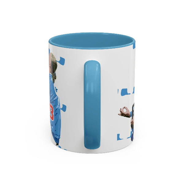 White mug with blue interior and handle featuring a printed design on a white background
