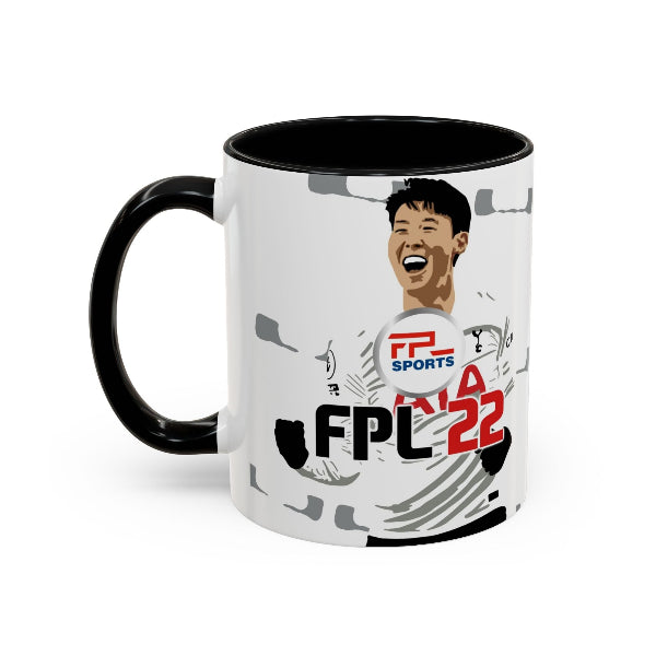 A ceramic mug with a black handle and black interior, featuring a white printed graphic of a soccer player and the text 'FPL SPORTS FPL 22'.
